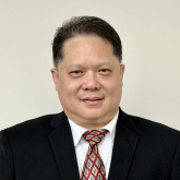 Drg. Ignatius Ronny Halim, FICOI, FISID, FICD portrait